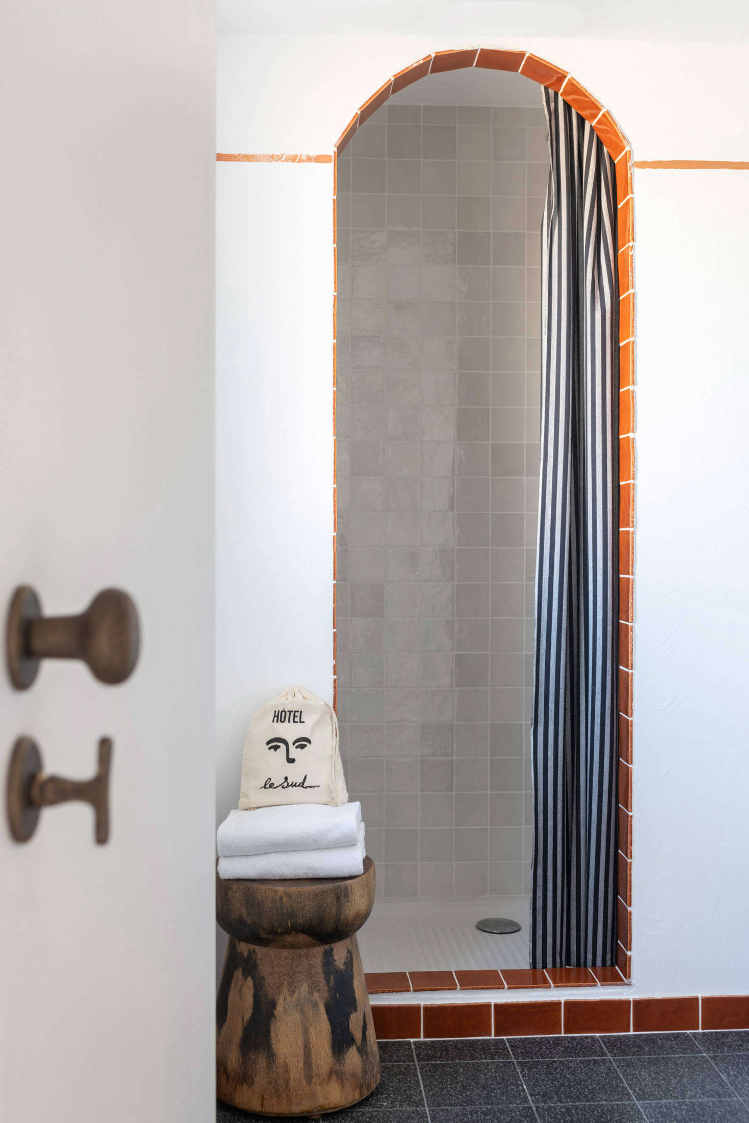 The bathrooms are accented with terra cotta tile.