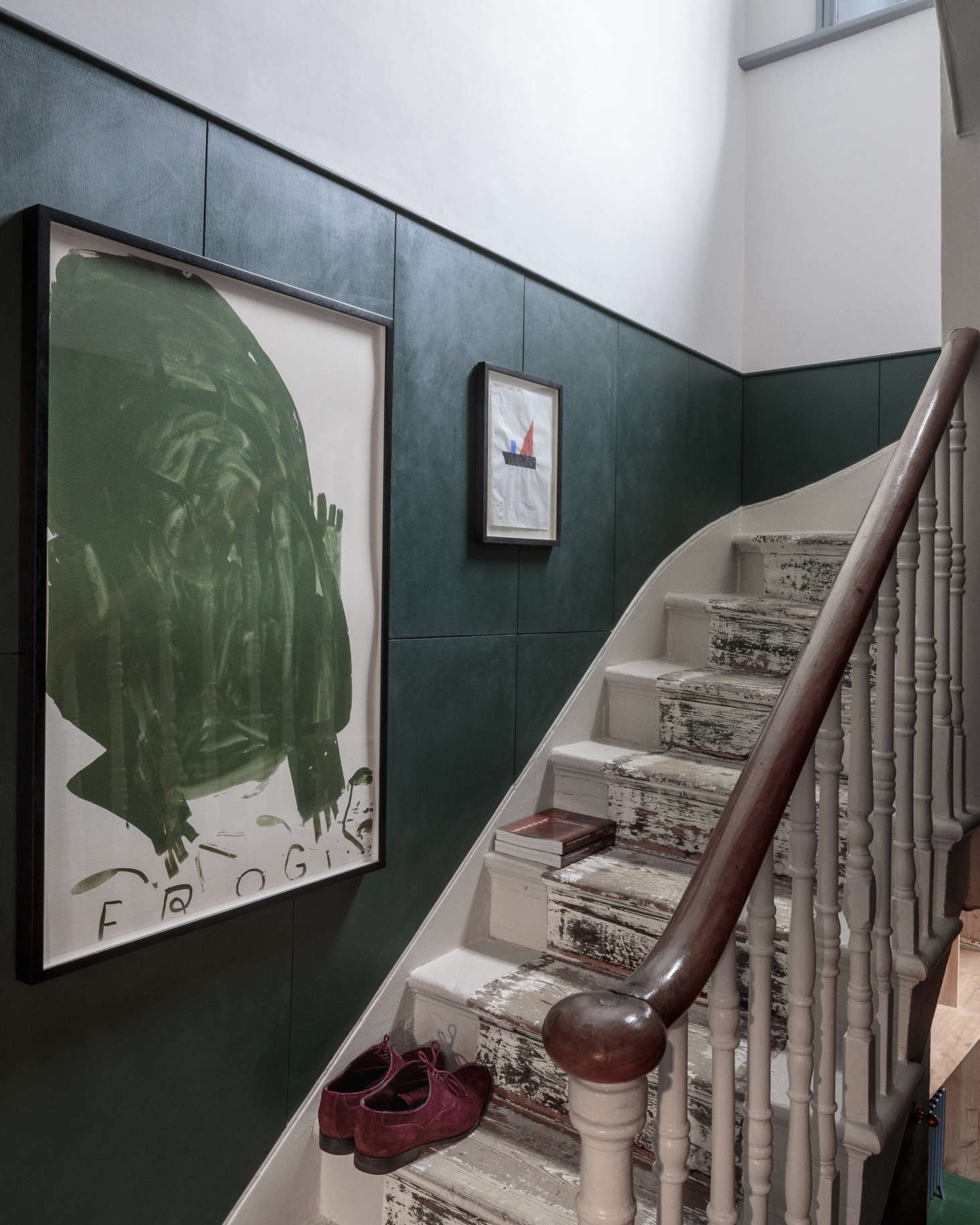 The staircase was artfully preserved—with its old runner removed and the remaining footprint left as is, but the sides of the steps were carefully repainted. What the architects describe as 