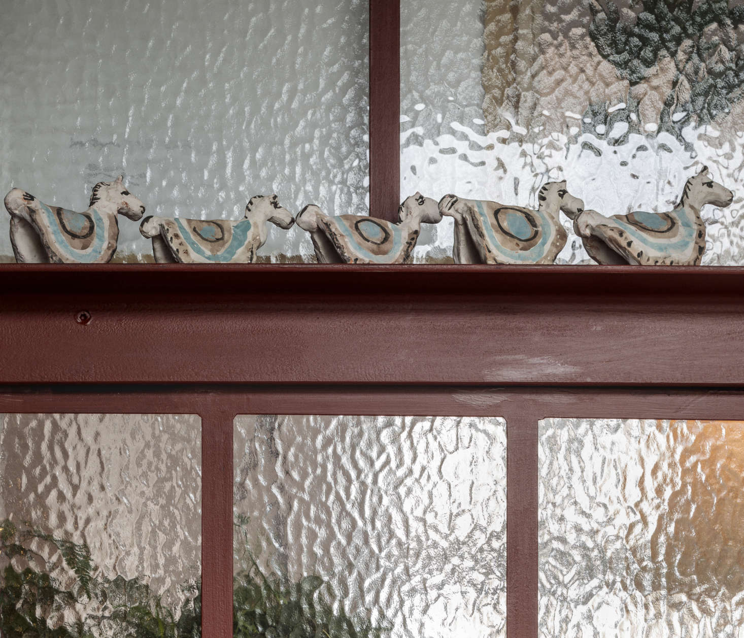 The architects chose industrial stippled glass to 