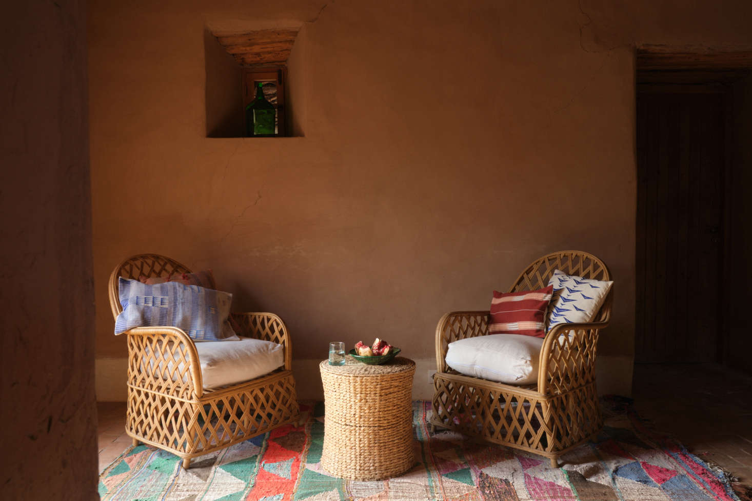 Textural, colorful Nagaland Cushions come in various sizes and shapes, both lumbar and square. Shown here are, left to right, the Jotsoma ($99), Mayang ($9), Sangti ($89), and Saramati ($85), each named for a region of Nagaland. On the table is the Moroccan Glass in Medium ($45) with an ever so slightly tapered lip.
