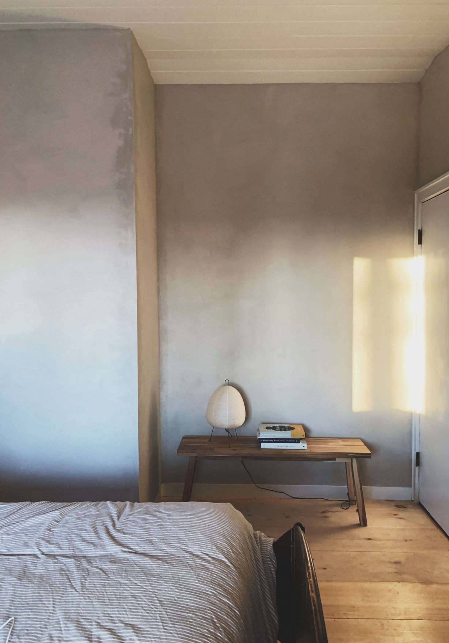 In the bedrooms, the couple opted to sheet-rock the walls and coat them in 
