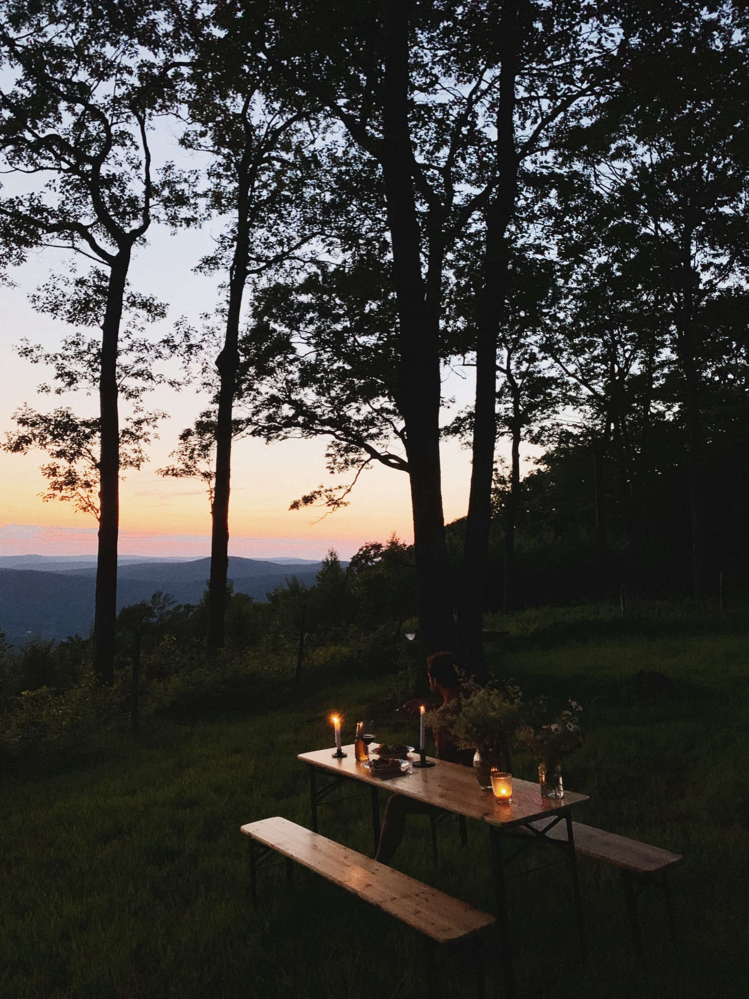 A setup for simple outdoor dinners at the cabin, looking out at the valley below.