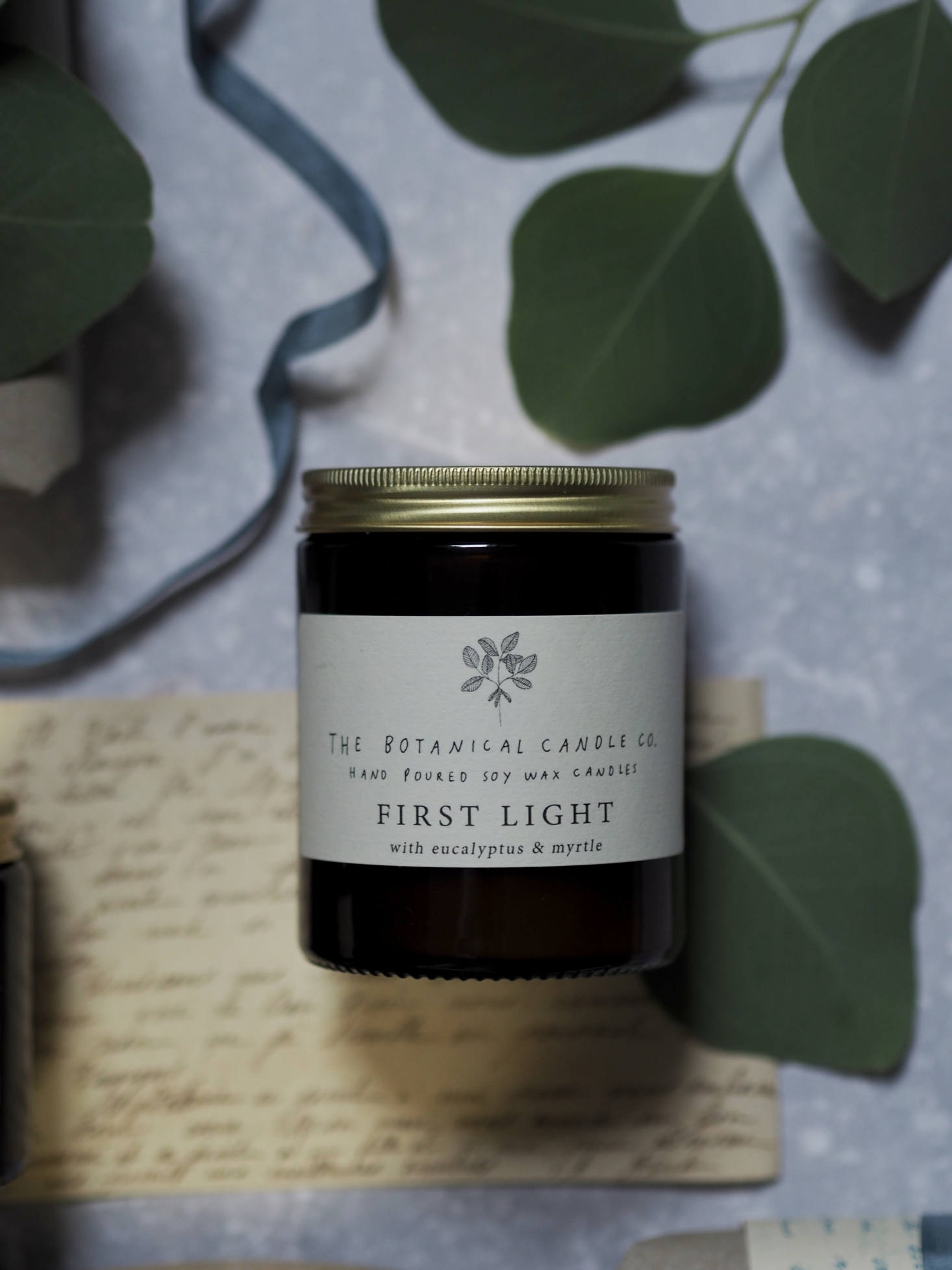 I also love the idea of these candles by UK-based Botanical Candle Co.: one for lighting early in the morning—First Light, shown here, with notes of eucalyptus and myrtle, another for lighting 