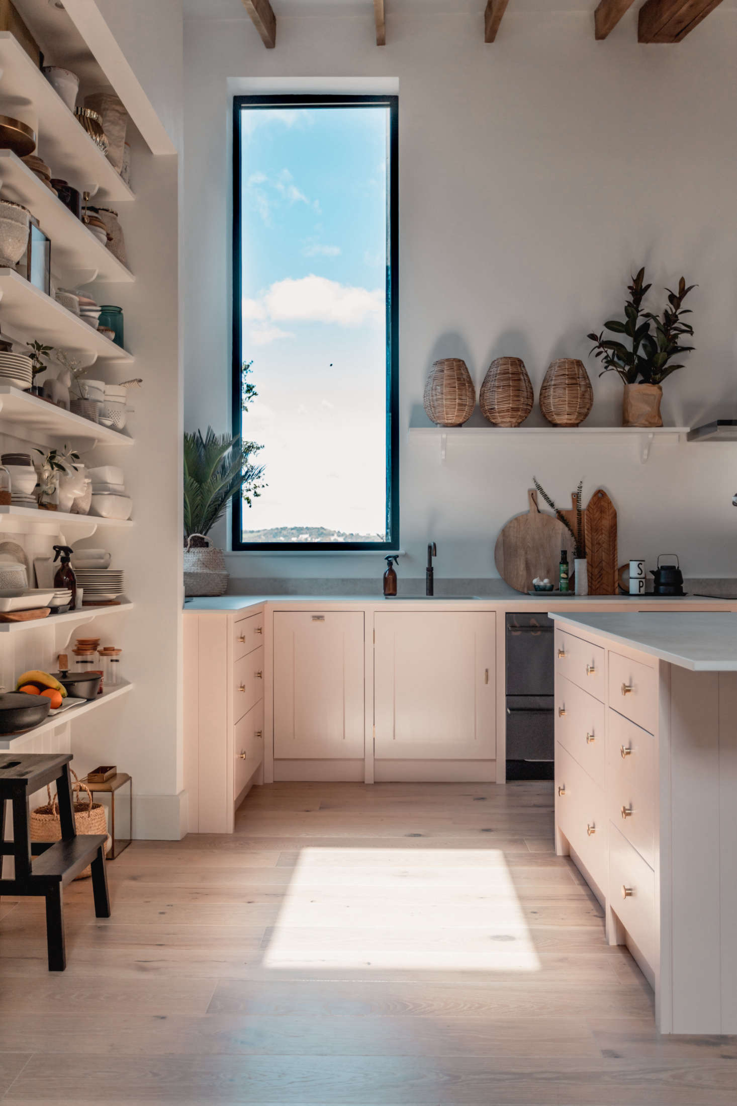 The wide-planked floors are from Woodpecker Flooring.