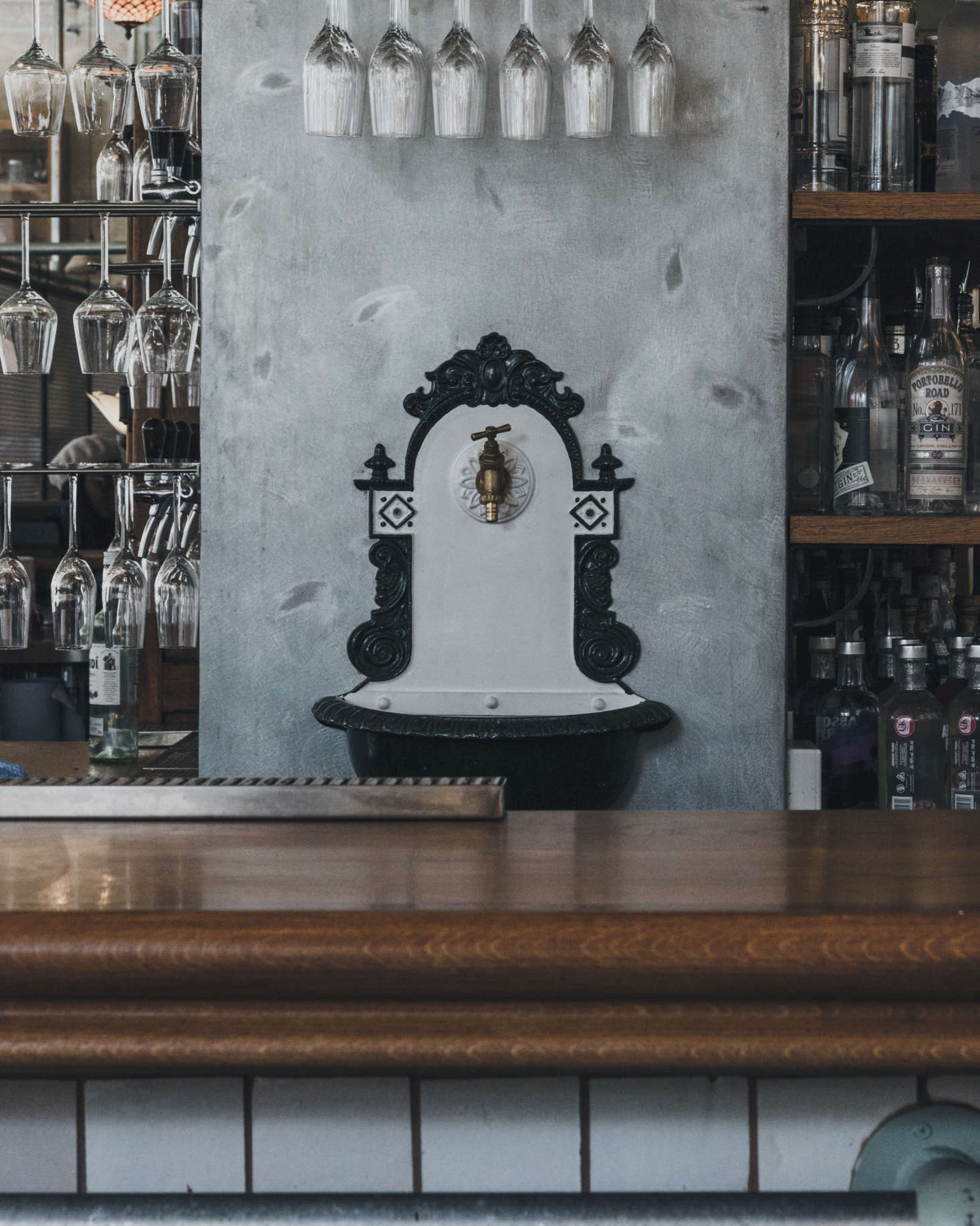 A vintage spigot behind the bar. Not pictured: a repurposed antique ice box from Argentina, which now holds a selection of craft beers.
