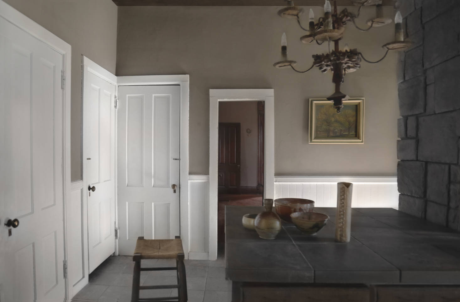 The cookspace has a stone hearth and original doors and is painted in Sherwin Williams