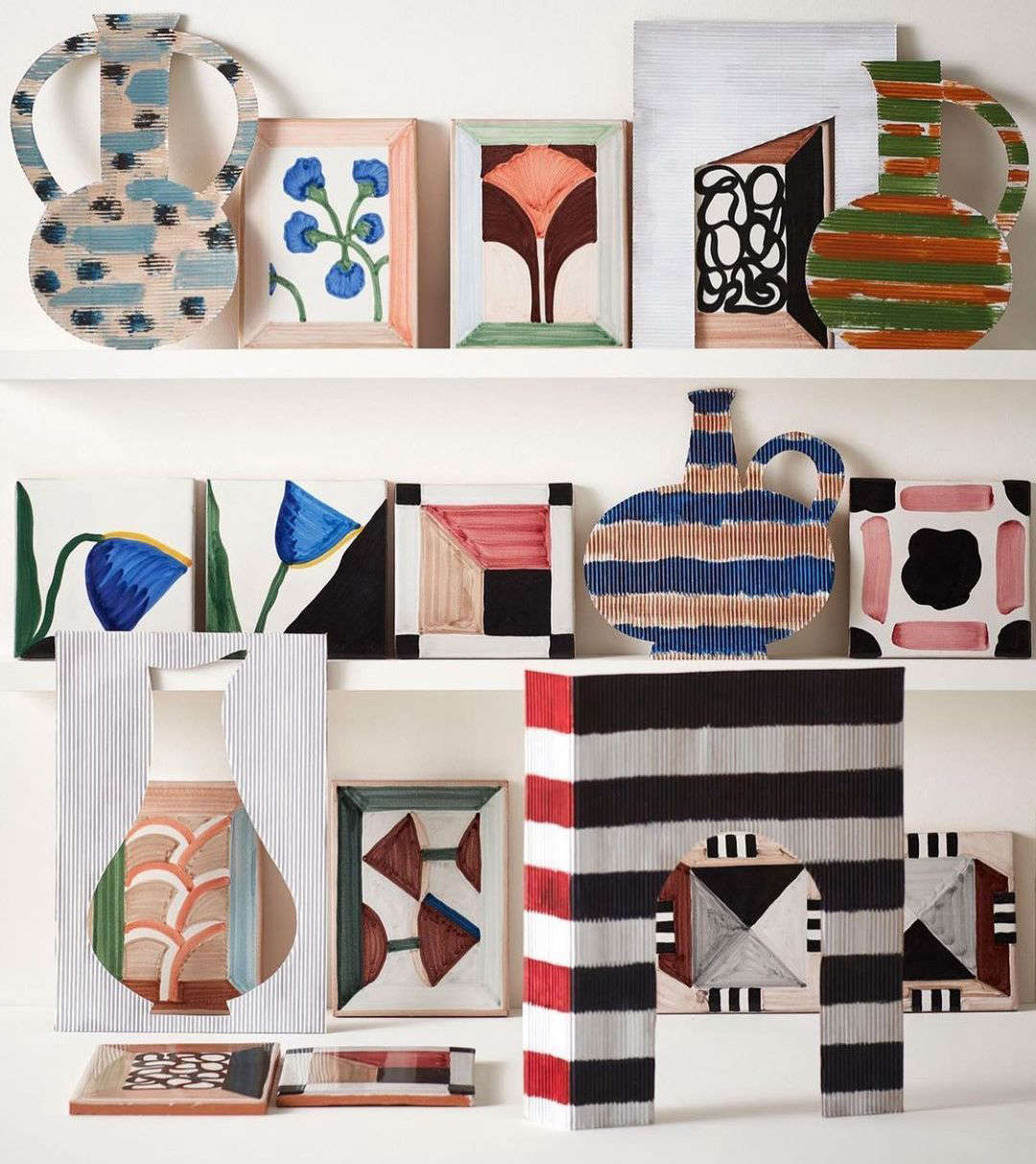The Wayne Pate Tile Collection I is hand-painted on terracotta. There are nine designs: five rectangular vignettes and four abstract square designs.