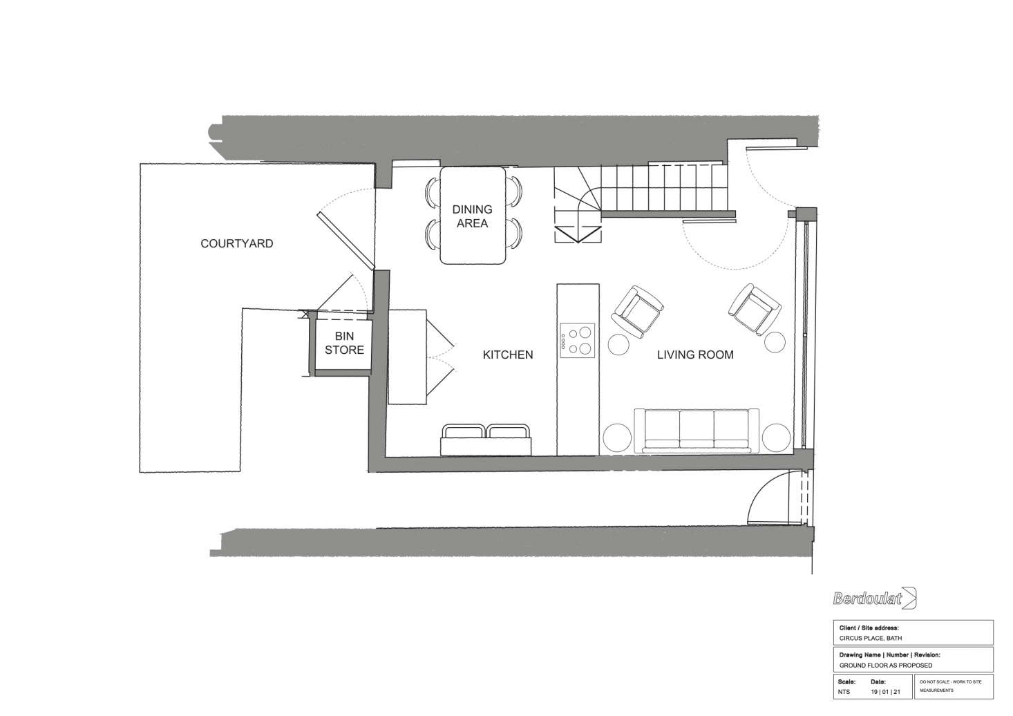 A car previously lived here. The salvaged store counter now divides the small living area from the kitchen. A door on the back wall opens to a garbage shed and courtyard. The new stairs lead to two ensuite bedrooms.