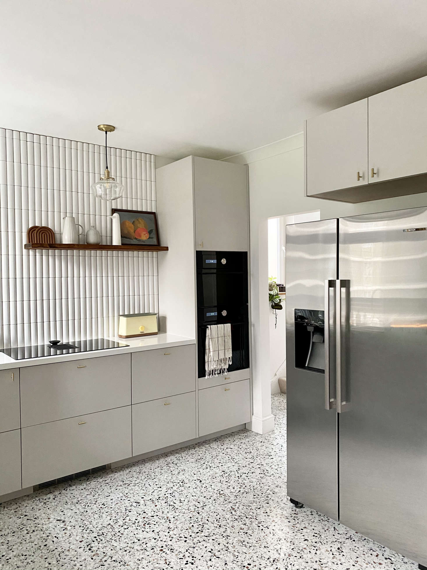 The fridge, a Bosch, is now centrally located. The 