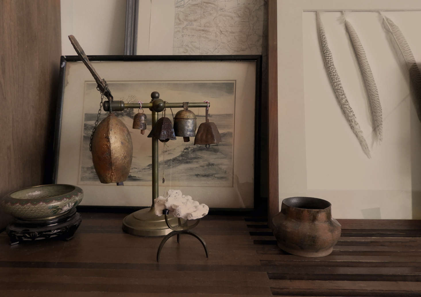 Among the treasures displayed on the shelves: a grouping of bells. 