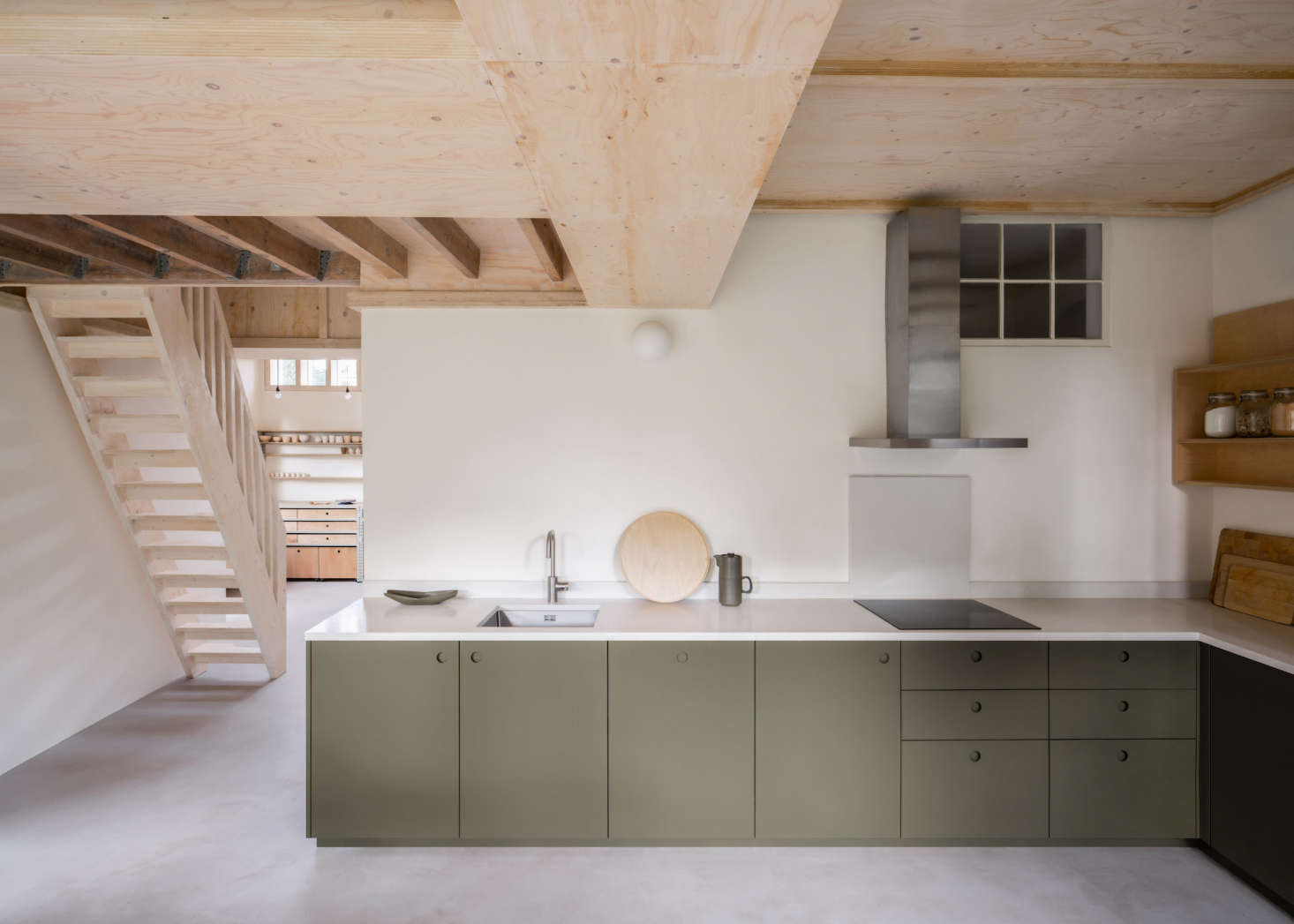 Peter and Sally live in an old Victorian house in Norwich, England, with their three children. They hired Thom to transform an unused garage into a large studio space for their creative work and to open up the kitchen to the garden. (Prior to the remodel, a utility room was wedged between the kitchen and the garden.) In lieu of 