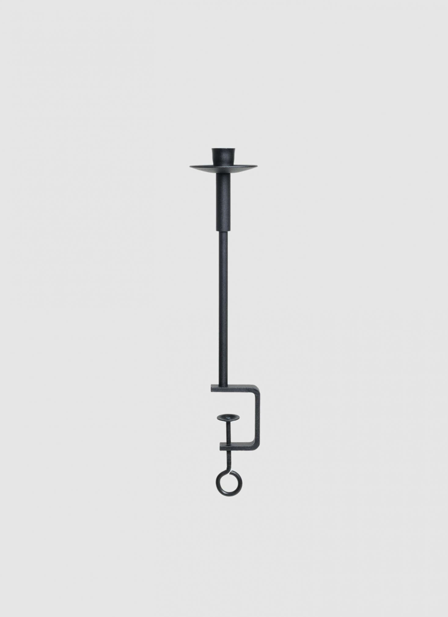 The Vages Handmade Cast Iron Candleholder comes in two sizes: the smaller is