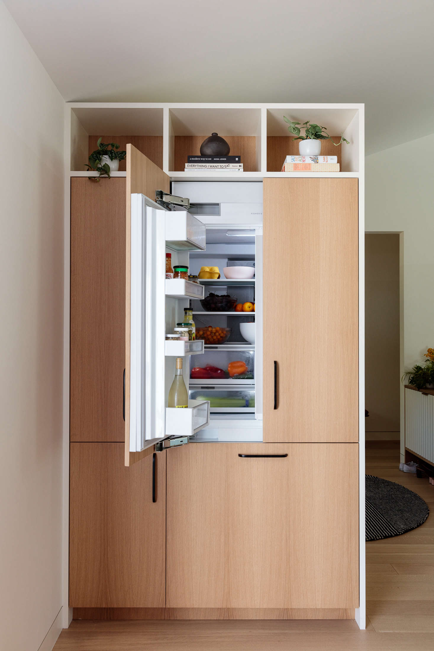 The 36” Integrated French Door Refrigerator Freezer in the LA kitchen, fitted with panels. The fridge has ActiveSmart technology that learns how you use your fridge—and adjusts airflow, temperature, and humidity to keep everything fresher longer.