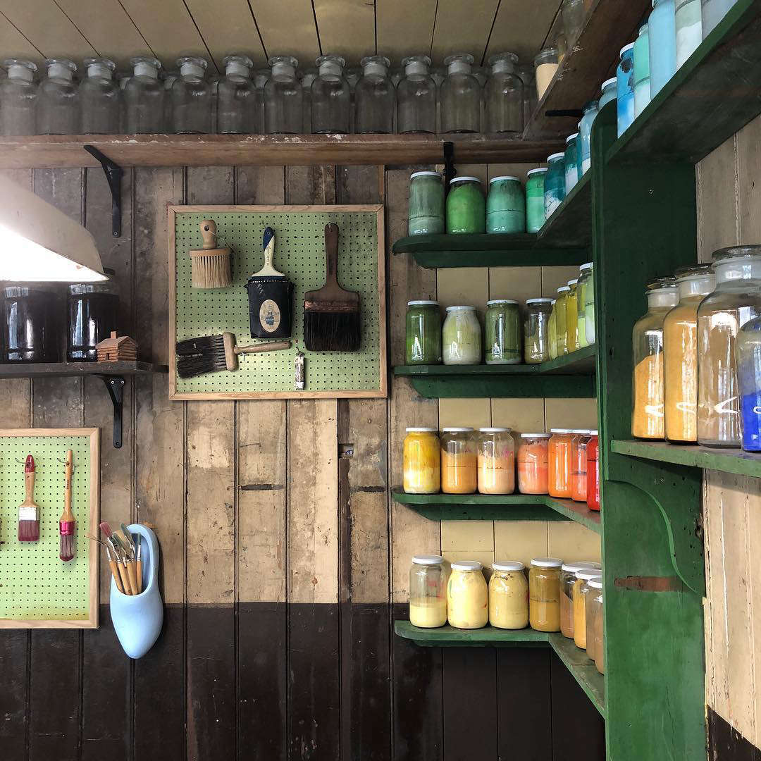 Pigments line the walls of the shop, ready for experimentation.