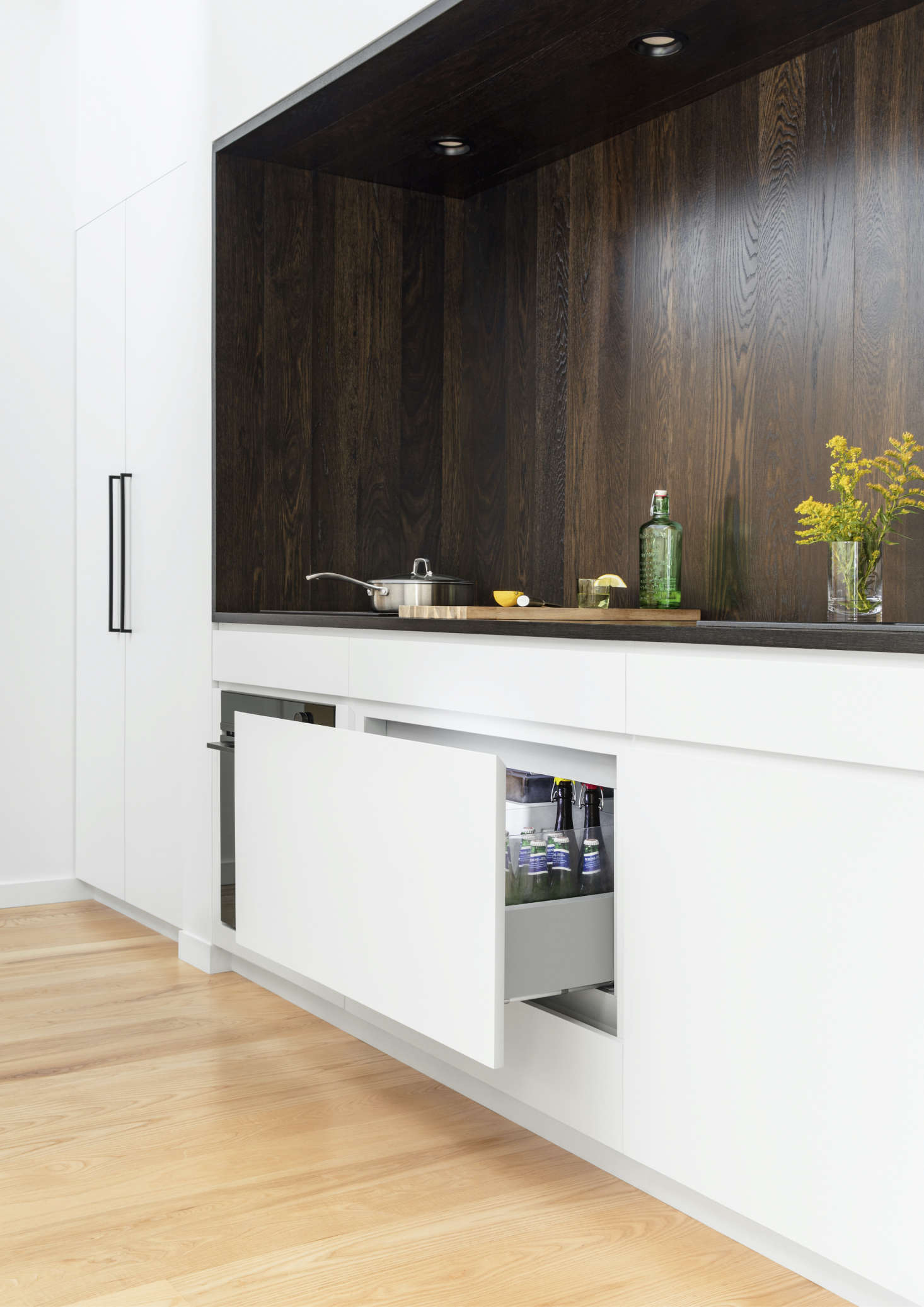 The Integrated CoolDrawer Multi-Temperature Drawer in situ. The drawer’s temperature can be changed at the push of a button, so that it can be used as refrigerator, freezer, pantry, chiller, or wine storage—and it’s fronted here with a custom panel, so it cleverly blends into the cabinets when closed. Photograph by Mark Wickens.