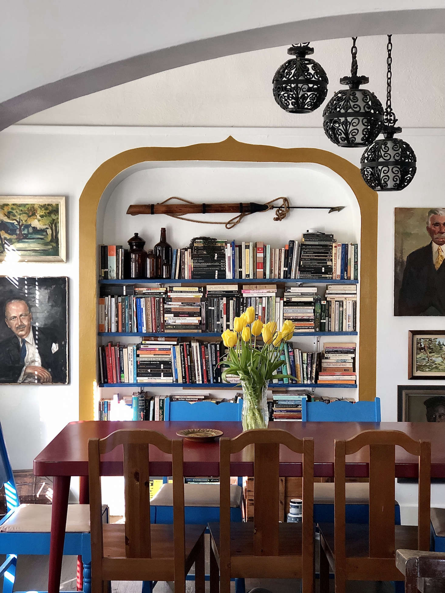 In the dining room, Gillian framed the inset wall shelves with a ribbon of paint (Behr