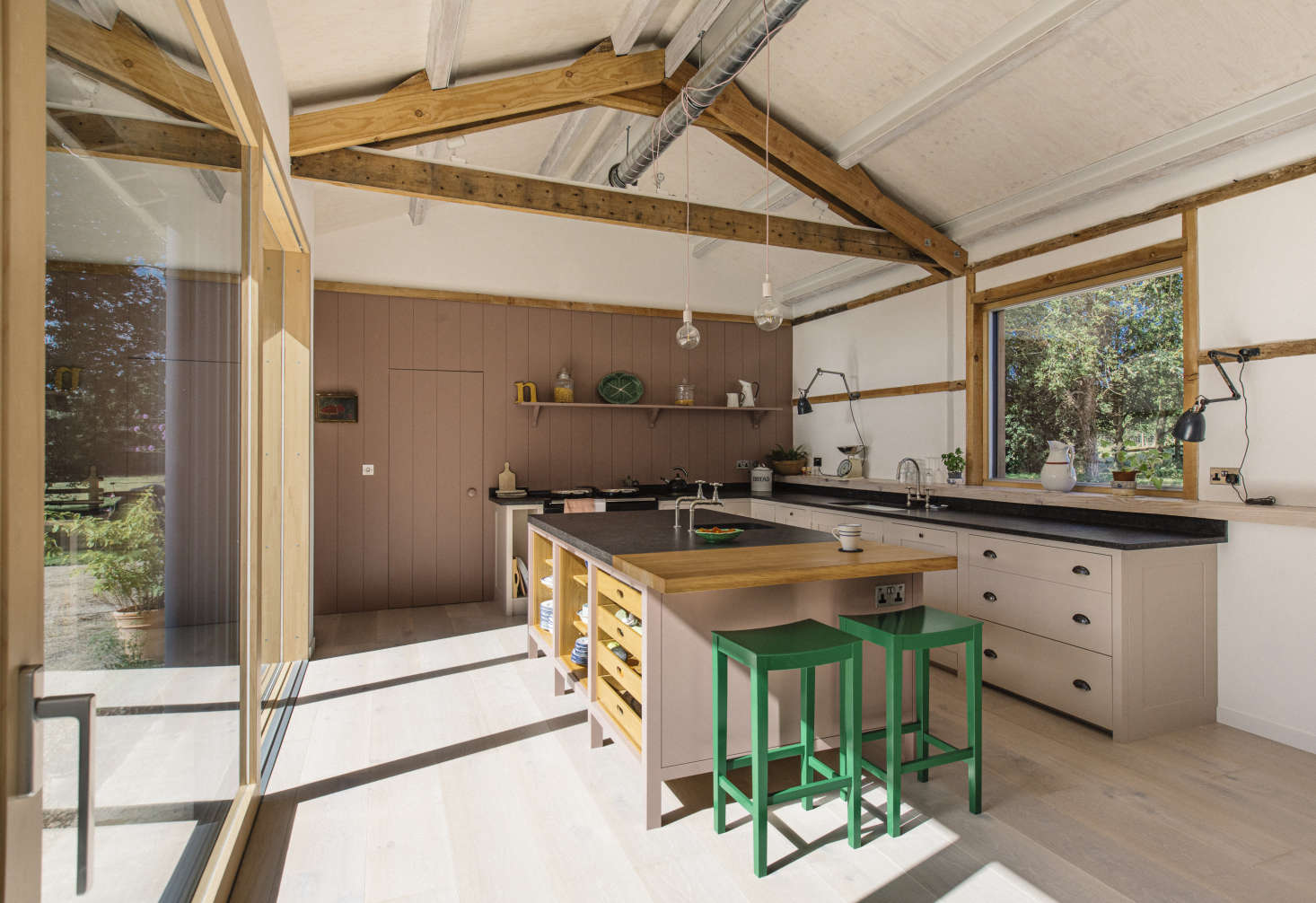The tongue-and-groove paneled back wall and door opens to a pantry that