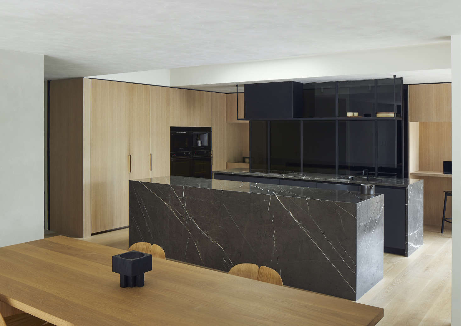 A selection of Minimal-style appliances and companion products—a Built-In Coffee Maker and Combination Steam Oven, two Integrated Wall Ovens, a Column Refrigerator, and a Column Freezer—suit a pared-back Auckland, New Zealand, kitchen by Keshaw McArthur. Photograph by Simon Wilson.
