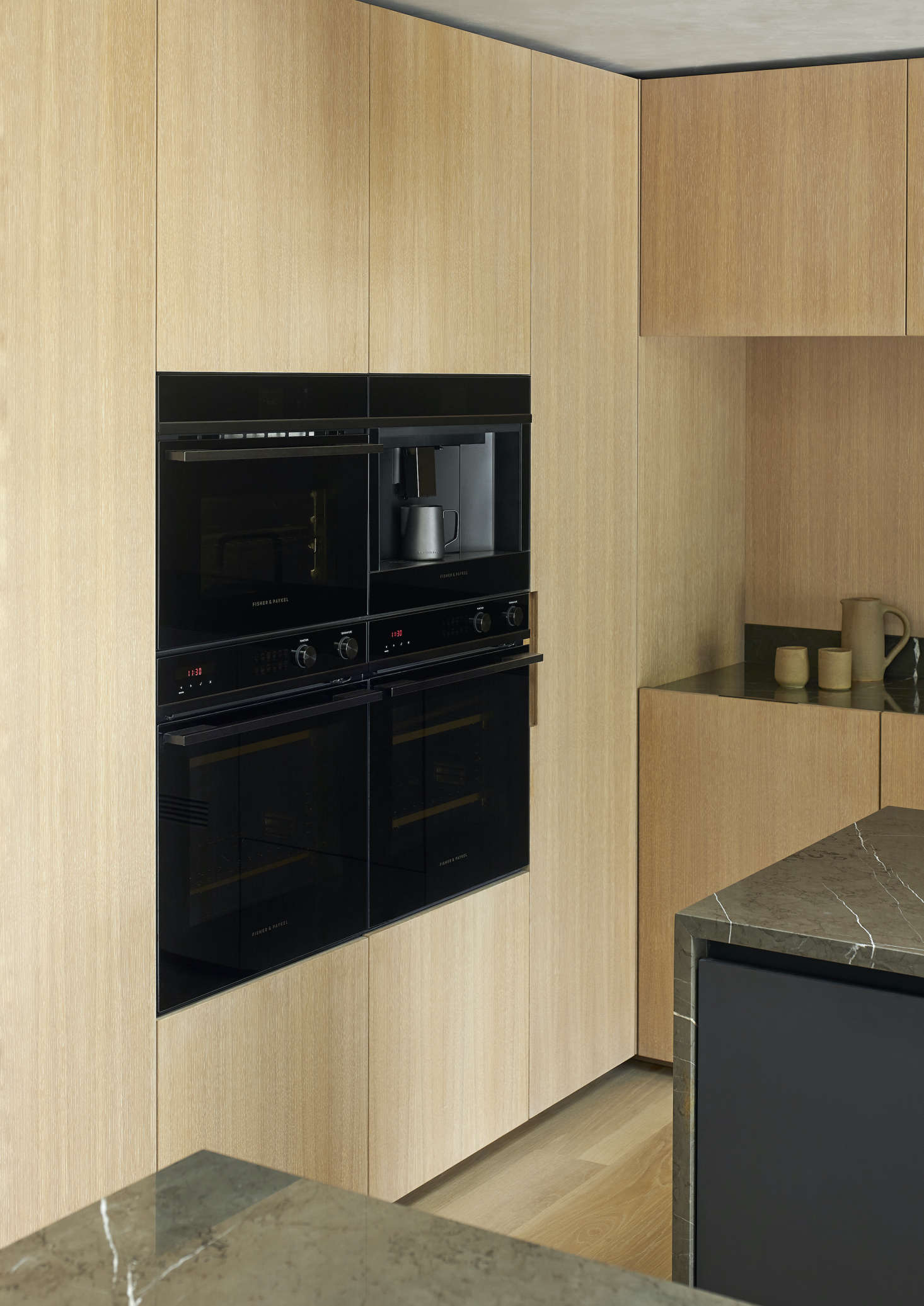 Two Integrated Wall Ovens create multiple opportunities for baking and cooking—all in a sleek front that seamlessly fits into a wall of cabinetry. Photograph by Simon Wilson.