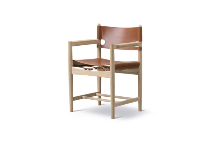 a børge mogensen spanish dining chair is seen at the dining table; contact fre 31