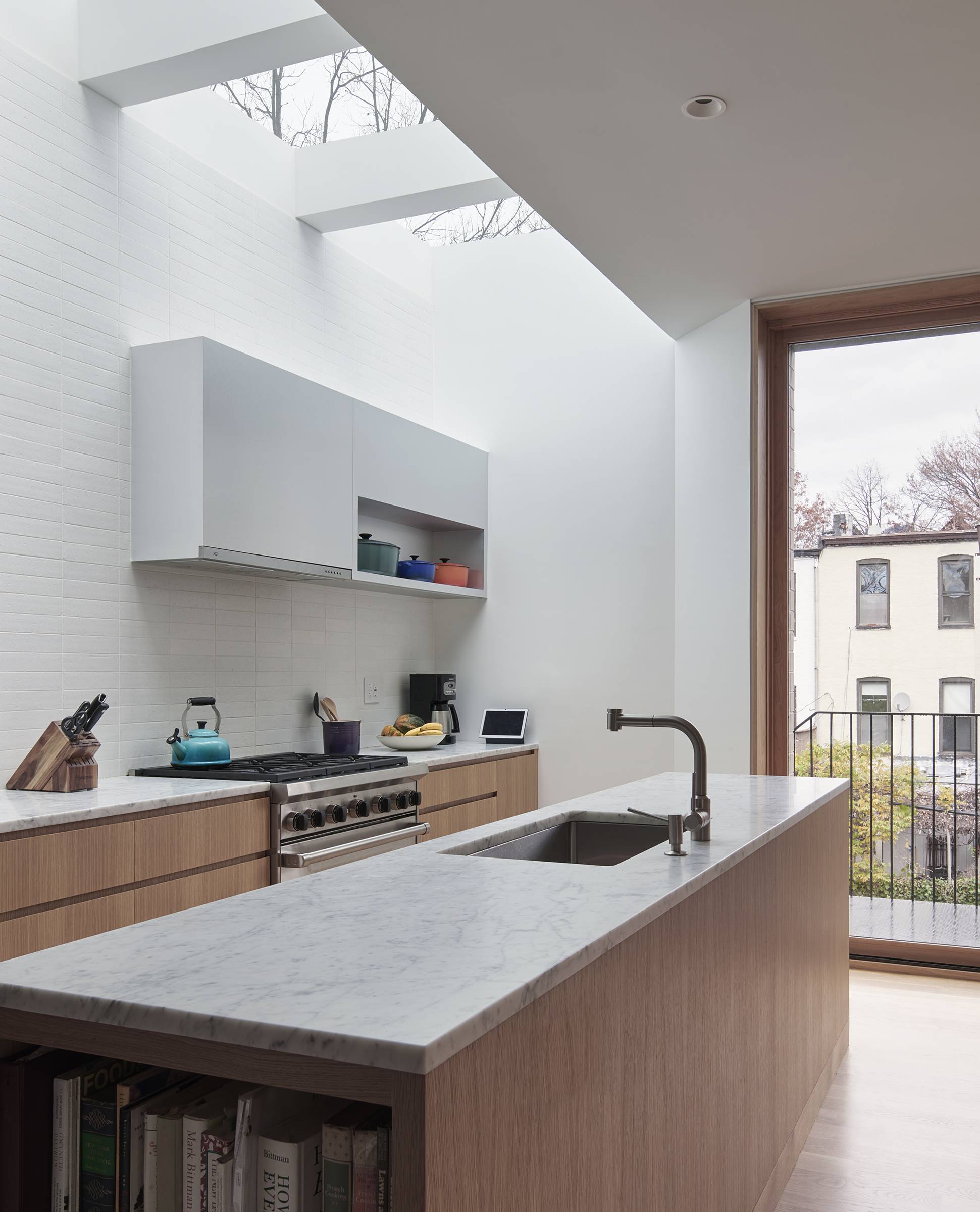 a tile backsplash extends all the way from counter to skylight. &#8\2\20;th 20