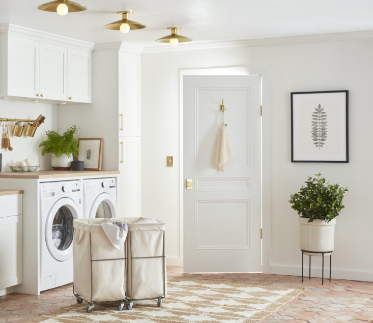 bins and baskets large and small are an easy way to keep the laundry room looki 20