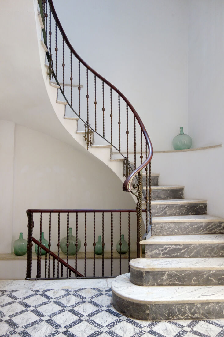 a grand spiral staircase in varieties of marble connects each of the floors 32