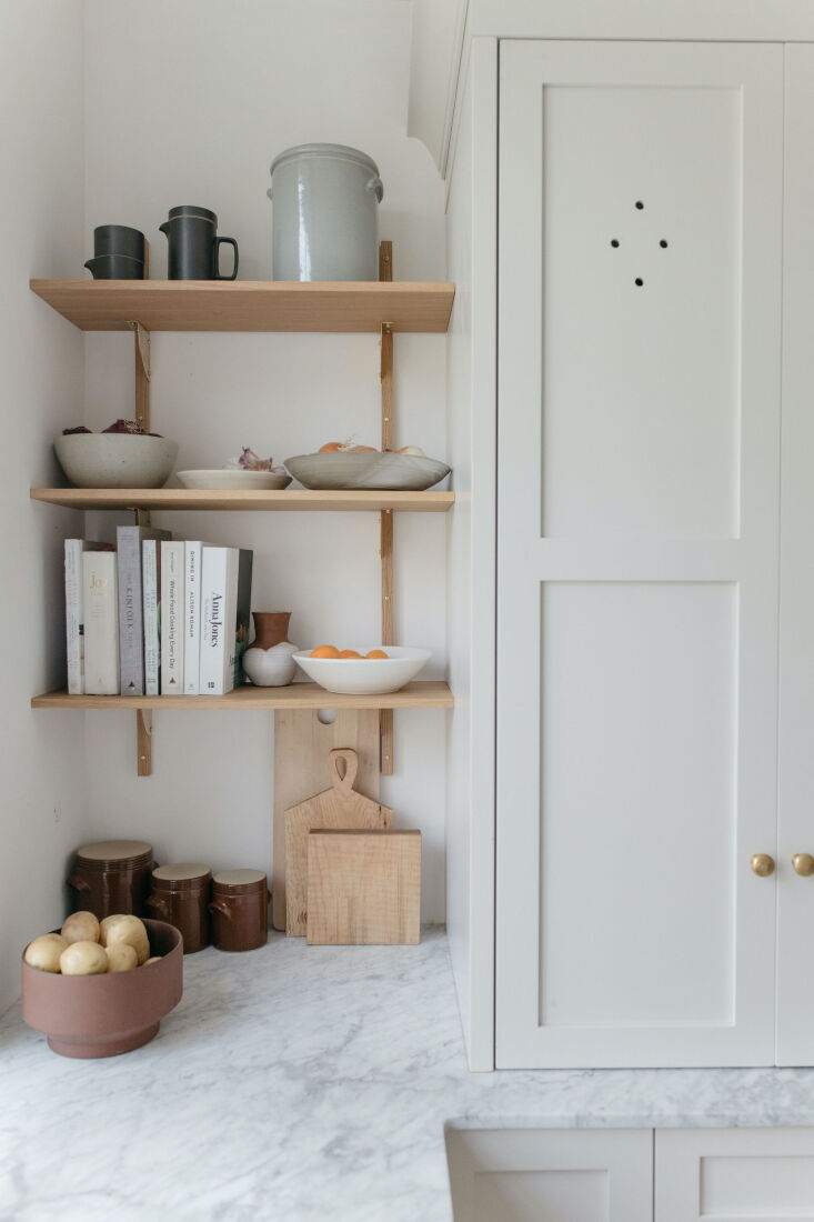 ferm living&#8\2\17;s oak and brass sector shelf is a perfect fit next to t 20