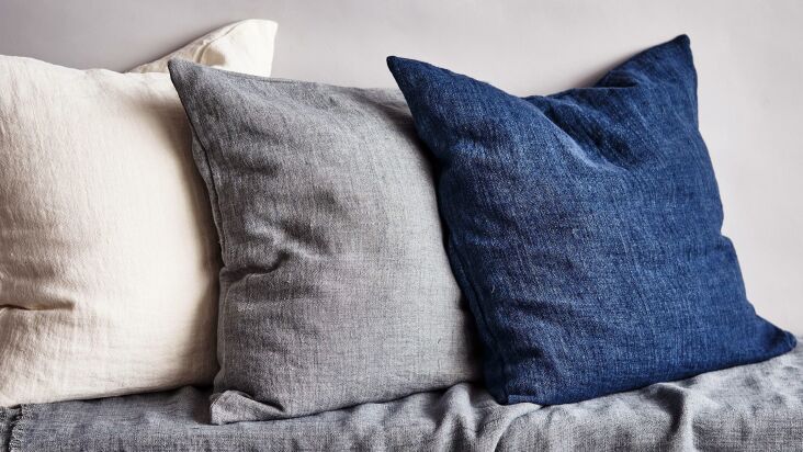 the washed woven linen pillow in indigo is \$\157.\20 from rw guild. 25