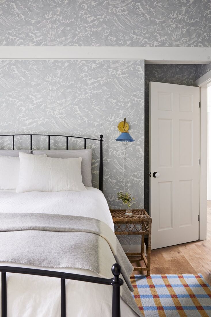 a bedroom in quercus & co.&#8\2\17;s tempest wallpaper in celeste. 17