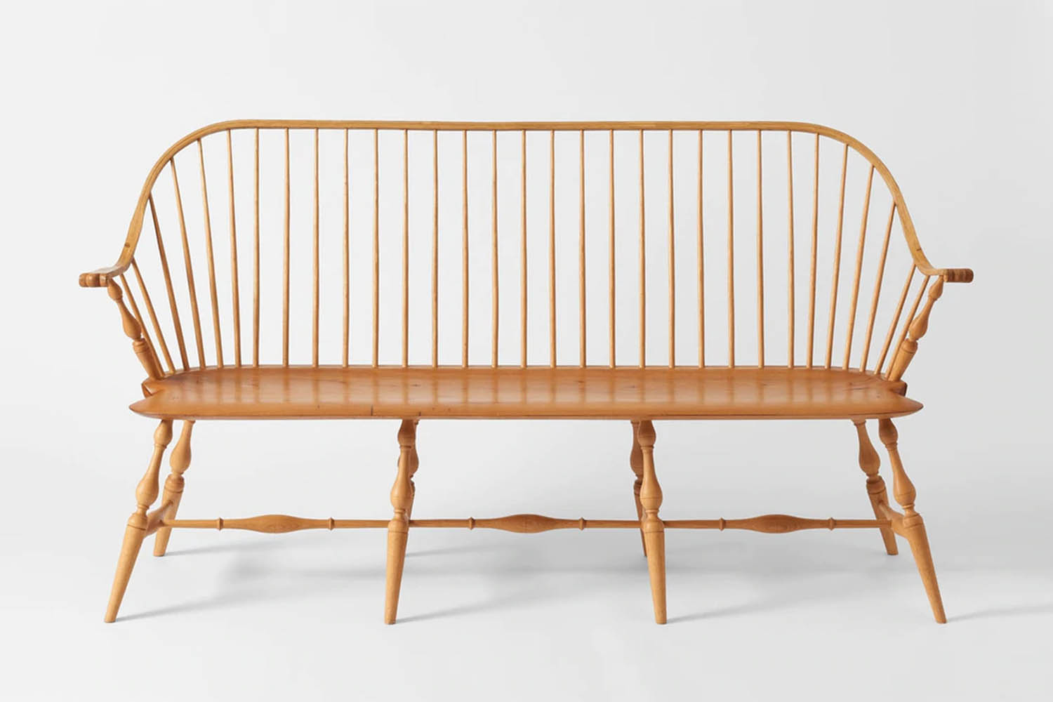 the black windsor bench is handmade from windsor chairmakers. the sawyer made w 23