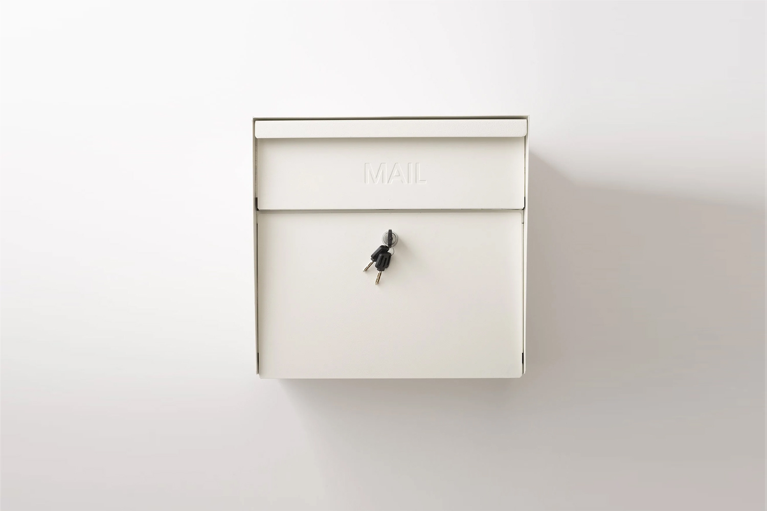 the schoolhouse locking mailbox comes in natural white or black for \$\159 at s 23