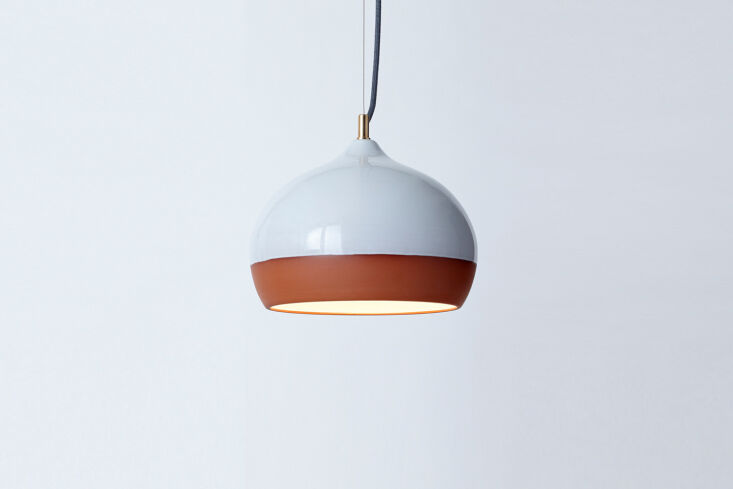 the pendant light is the terracotta medium pendant from hand and eye studio in  24