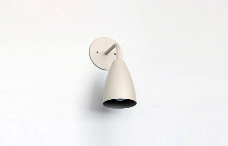 the onefortythree solid color shaded sconce, shown in off white diamondback, is 18