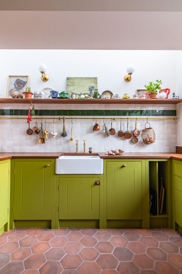 the core kitchen cabinetry is from british standard with a custom brass rail th 18