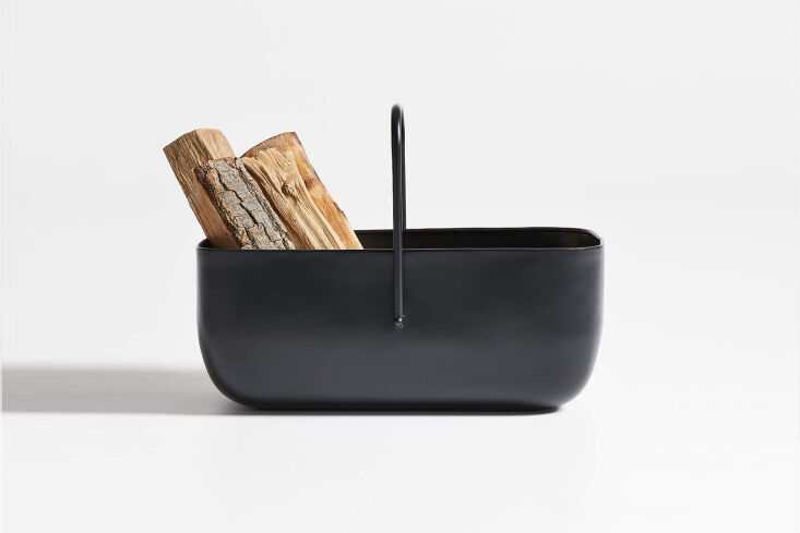 the telum black log holder, made of black iron, is \$\279 at crate & barrel. 19