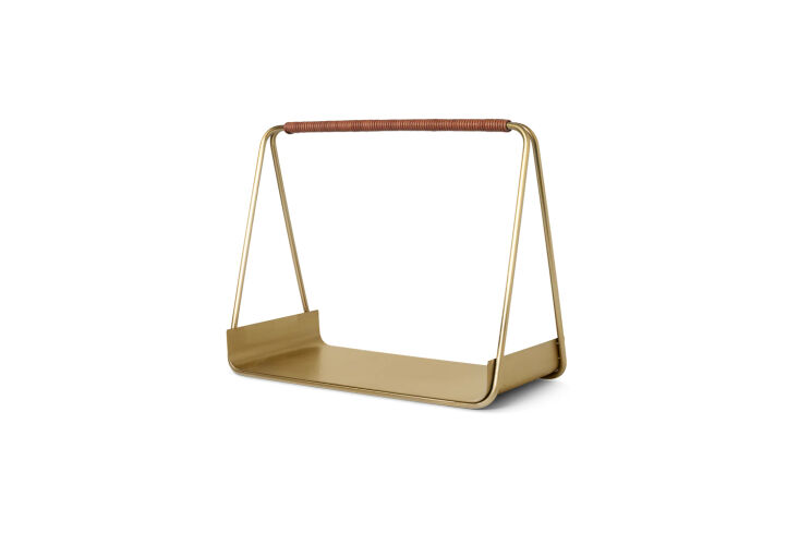 the ferm living port wood basket is designed almost like a tray, with rounded e 24
