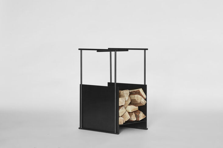 the black firewood hutch, designed by thom fougere for mjölk, is made of a thi 21