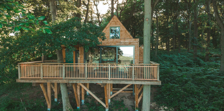 the cabin rests on stilts—no concrete was used in its construction–and the 34
