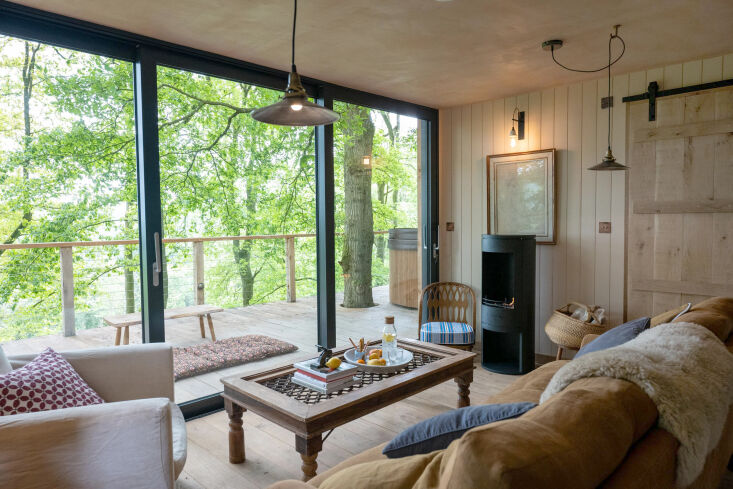the living room opens to a wide deck with wood burning hot tub. 24