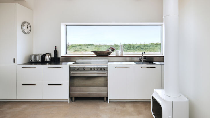 the recent kitchen extension, with far reaching views over the grassy dunes. 20