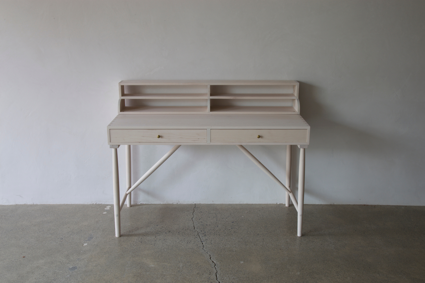 The Sawkille Desk is available in American black walnut, hard maple, or white oak; finishes (bleached, oiled, ebonized, or fumed) can be customized. Contact Sawkille directly for pricing and lead times.