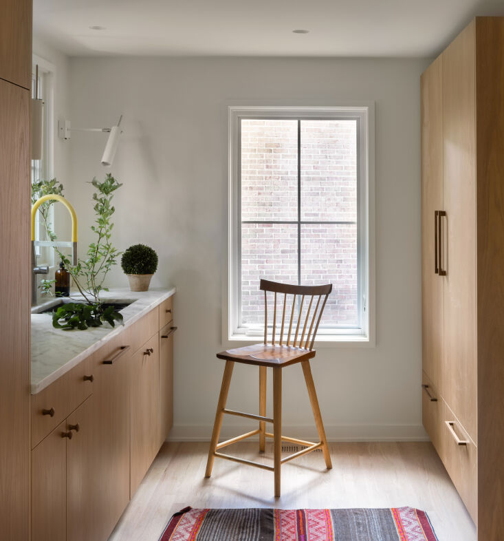the fridge and a second sink and dishwasher are tucked out of sight in the pant 23