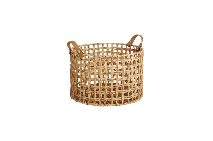 the honeybloom round weave water hyacinth storage basket is \$34.99 from at hom 29