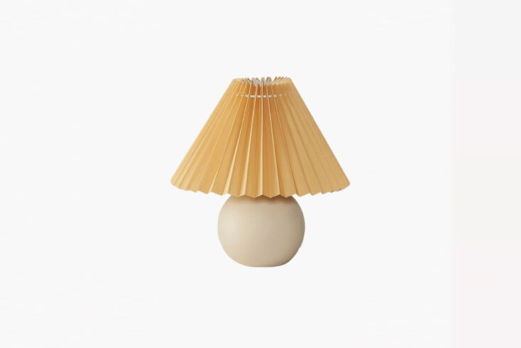 a similar small table lamp with pleated shade is the serena ceramic table lamp, 24