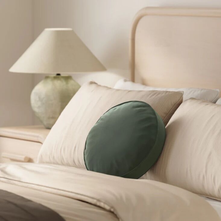 the bonnie velvet round pillow is also available in three colorways: yarrow gol 21