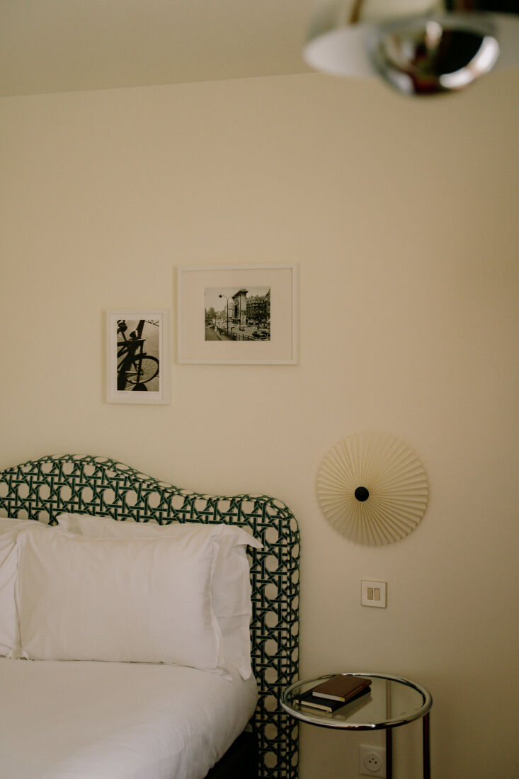 metal nightstands evoke outdoor furniture, while hay matin wall sconces add an 24