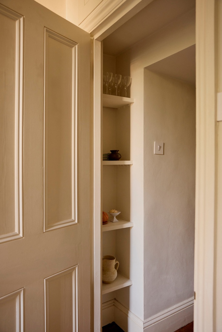 right outside the bedroom door, a sweet little nook with shelves. 25