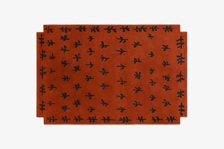 proof that red can be elegant, not garish: a rust hued rug with whimsical patte 24