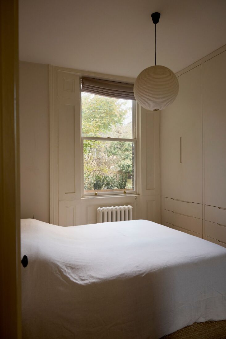 a wall of built in wardrobe closets provides plenty of storage opportunities to 23